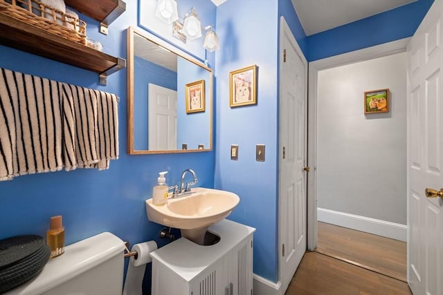 762 Tremont St Unit 5, Boston, MA 02118 - bathroom featuring a sink, wood finished floors, toilet, and baseboards