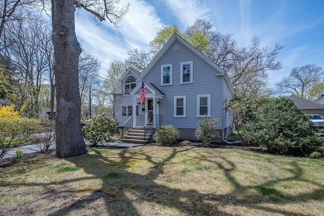 victorian-style house featuring a front lawn