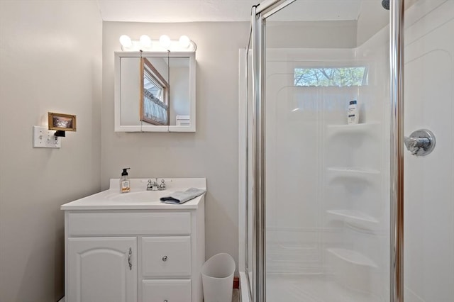 bathroom with a stall shower and vanity