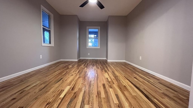 spare room with ceiling fan and light hardwood / wood-style flooring