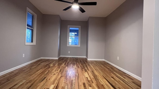 unfurnished room featuring ceiling fan and hardwood / wood-style floors