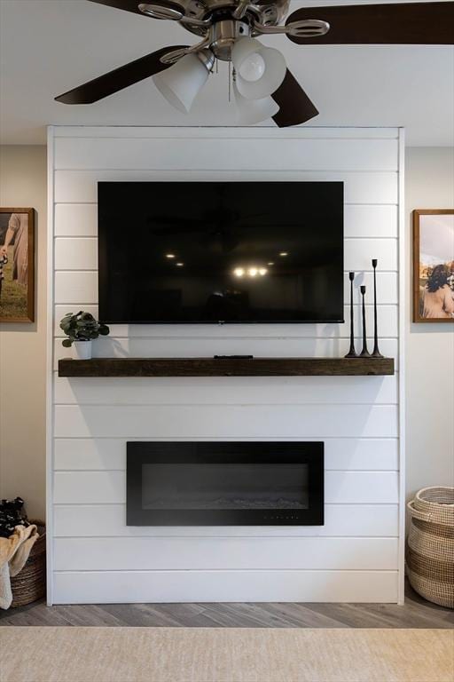 82 Davenport St, Springfield, MA 01119 - detailed view of a fireplace, ceiling fan, and wood finished floors