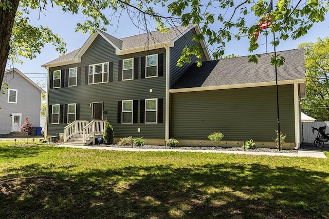 82 Davenport St, Springfield, MA 01119 - colonial inspired home featuring a front yard and roof with shingles