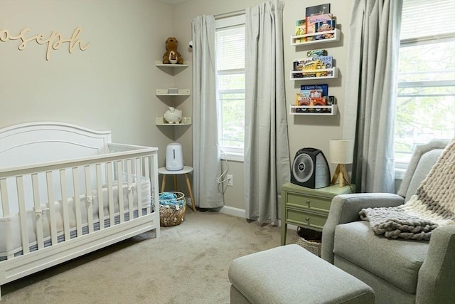 82 Davenport St, Springfield, MA 01119 - bedroom with a crib, carpet flooring, multiple windows, and baseboards