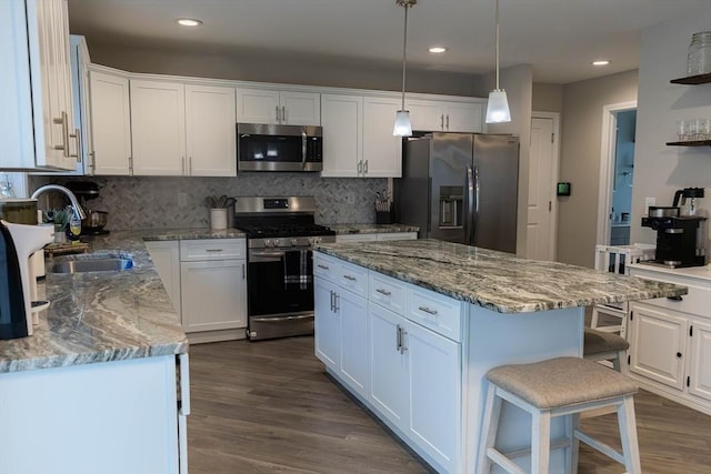 82 Davenport St, Springfield, MA 01119 - kitchen featuring stainless steel appliances, a sink, white cabinetry, backsplash, and recessed lighting