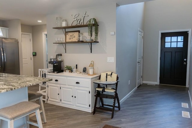 82 Davenport St, Springfield, MA 01119 - kitchen with freestanding refrigerator, dark wood finished floors, white cabinetry, baseboards, and open shelves