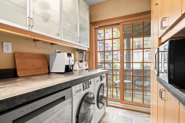 15 Concord Sq Unit 1A, Boston, MA 02118 - laundry room featuring washing machine and dryer and cabinet space