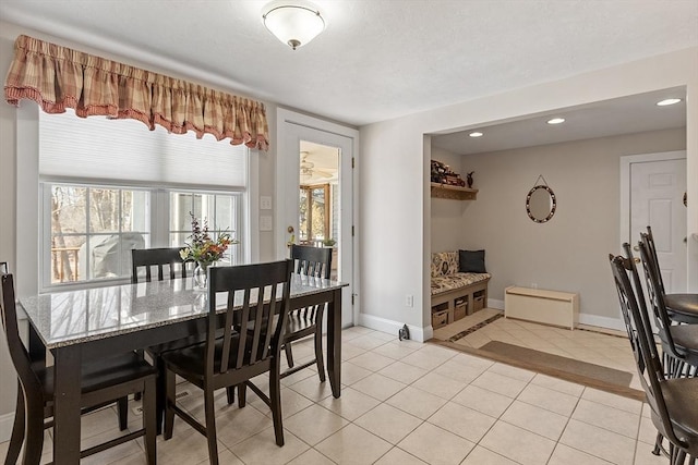 dining space featuring recessed lighting, plenty of natural light, baseboards, and light tile patterned flooring