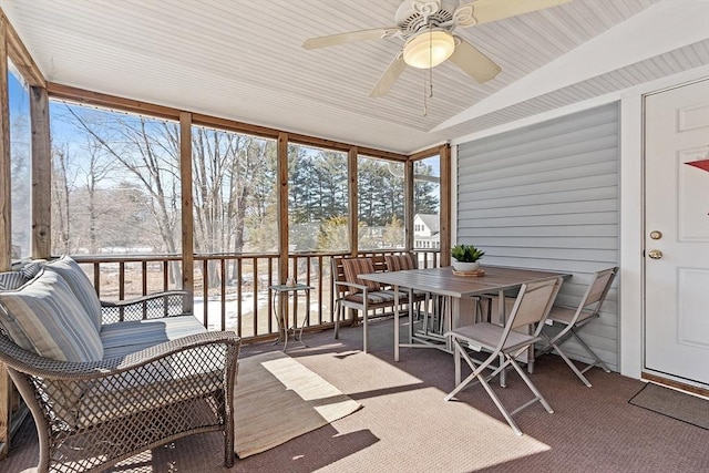 sunroom with a ceiling fan