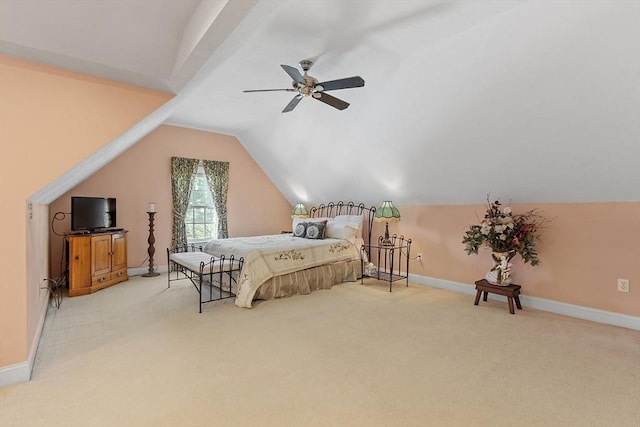 bedroom featuring light carpet, ceiling fan, lofted ceiling, and baseboards