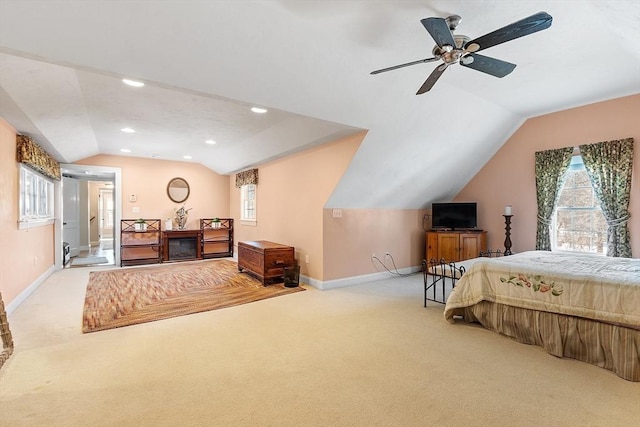 carpeted bedroom featuring lofted ceiling, multiple windows, recessed lighting, and baseboards