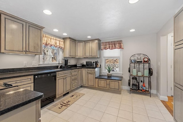 kitchen featuring recessed lighting, a sink, baseboards, dishwasher, and stainless steel microwave