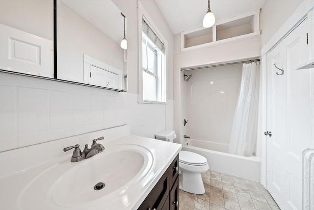 bathroom featuring toilet, vanity, shower / bath combo, and decorative backsplash