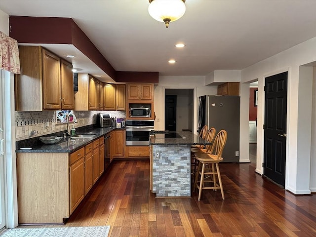 16 E Rd, Adams, MA 01220 - kitchen with brown cabinets, dark wood finished floors, appliances with stainless steel finishes, and a sink