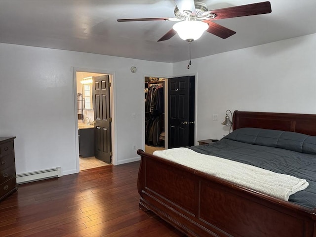 16 E Rd, Adams, MA 01220 - bedroom featuring a sink, baseboard heating, a closet, hardwood / wood-style flooring, and a walk in closet