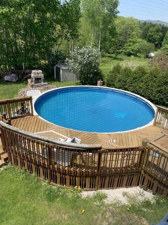 16 E Rd, Adams, MA 01220 - pool with an outdoor structure, a deck, and a shed