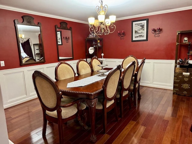 16 E Rd, Adams, MA 01220 - dining room with dark wood-type flooring, a decorative wall, crown molding, wainscoting, and a notable chandelier