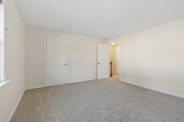 empty room featuring carpet floors