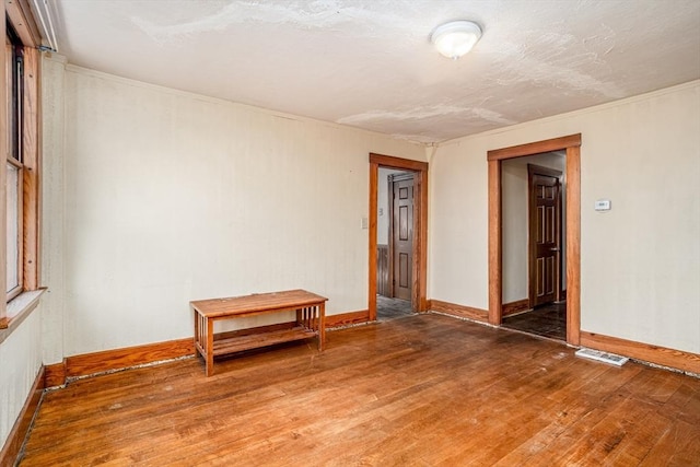 15 Green St, Gardner, MA 01440 - empty room featuring wood finished floors and baseboards
