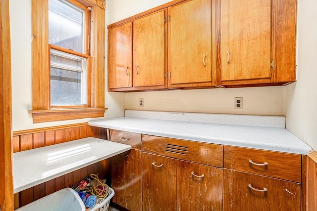 15 Green St, Gardner, MA 01440 - kitchen featuring plenty of natural light, light countertops, and brown cabinetry