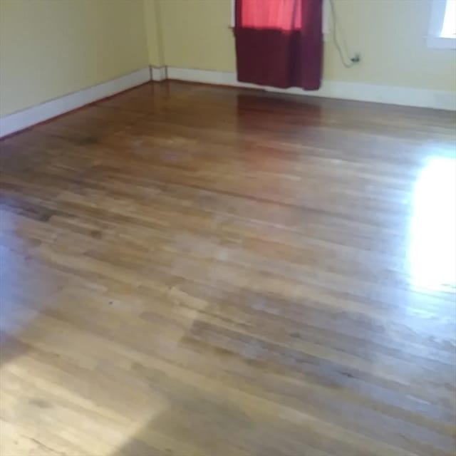 15 Green St, Gardner, MA 01440 - spare room with wood finished floors and baseboards