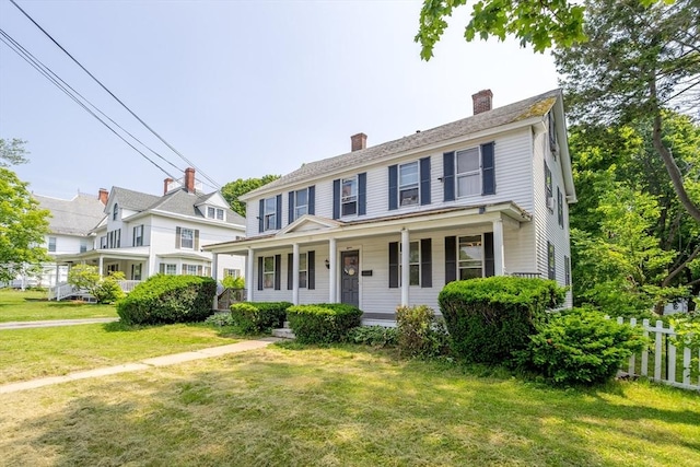 15 Green St, Gardner, MA 01440 - colonial-style house with a porch and a chimney