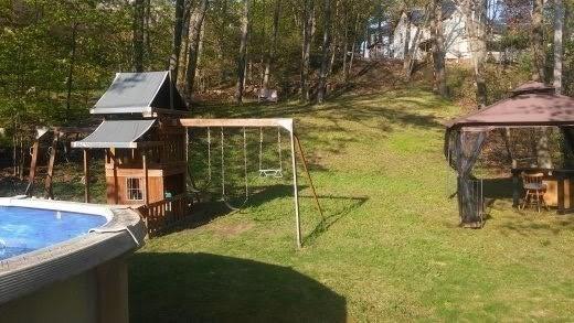 15 Green St, Gardner, MA 01440 - view of grassy yard featuring a gazebo and an outdoor pool