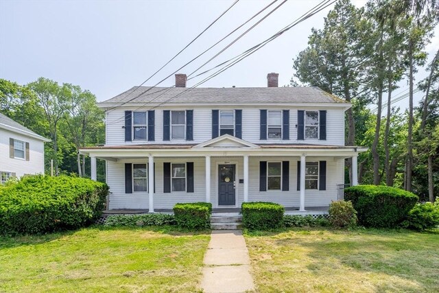 15 Green St, Gardner, MA 01440 - colonial inspired home with a chimney, a porch, and a front lawn