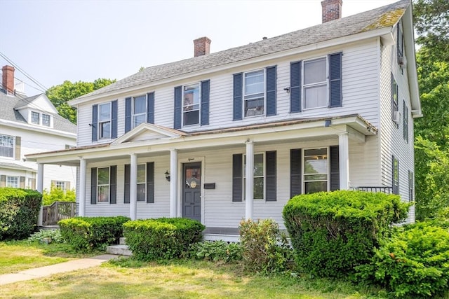 15 Green St, Gardner, MA 01440 - colonial-style house featuring covered porch and a chimney