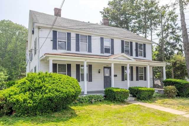 15 Green St, Gardner, MA 01440 - view of front of house featuring a chimney, a porch, and a front lawn