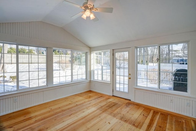 unfurnished sunroom with lofted ceiling and ceiling fan