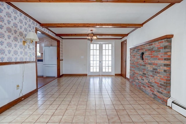 empty room featuring light tile patterned floors, a baseboard radiator, beam ceiling, and wainscoting