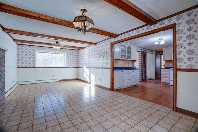 interior space featuring wainscoting, a baseboard radiator, and wallpapered walls