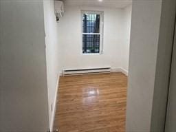 520 Shawmut Ave Unit 1, Boston, MA 02118 - corridor with baseboard heating, baseboards, and wood finished floors