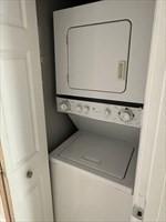 520 Shawmut Ave Unit 1, Boston, MA 02118 - clothes washing area featuring stacked washer / dryer