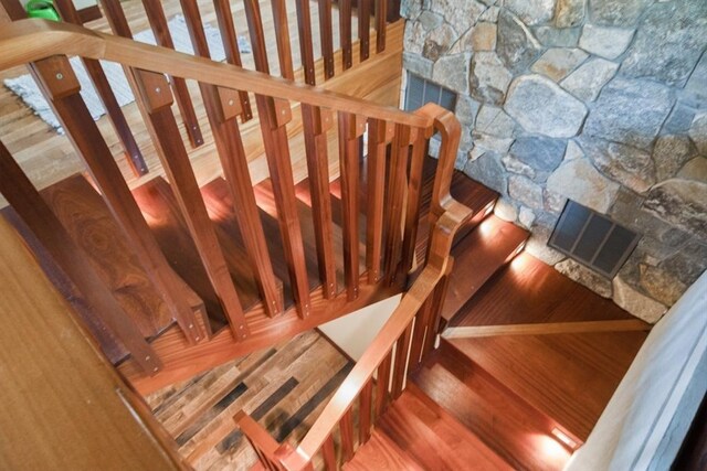 stairway featuring hardwood / wood-style floors