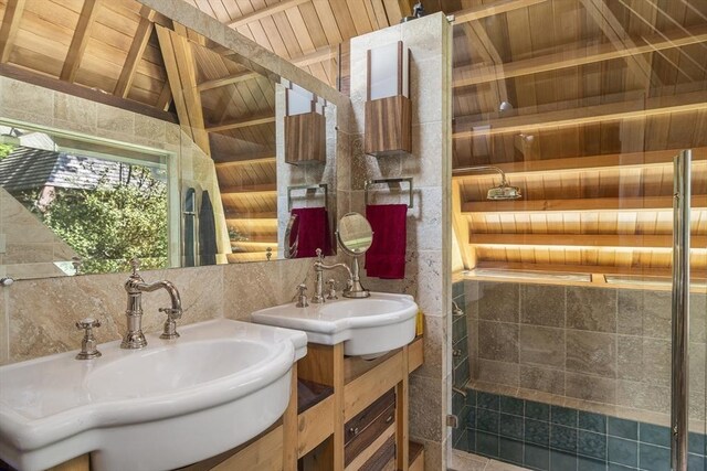 bathroom featuring wood ceiling, lofted ceiling with beams, tasteful backsplash, and vanity