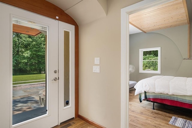 interior space with wooden ceiling, light hardwood / wood-style flooring, and vaulted ceiling