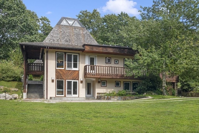 back of house featuring a yard