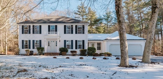 colonial-style house featuring a garage