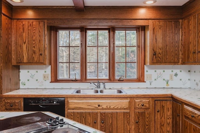 kitchen with beamed ceiling, black dishwasher, sink, and decorative backsplash