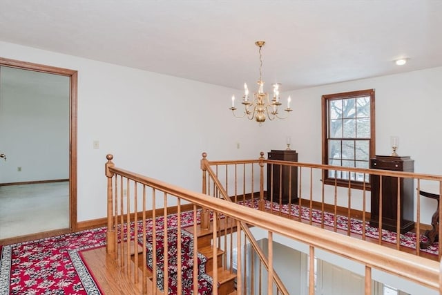 hall featuring a chandelier