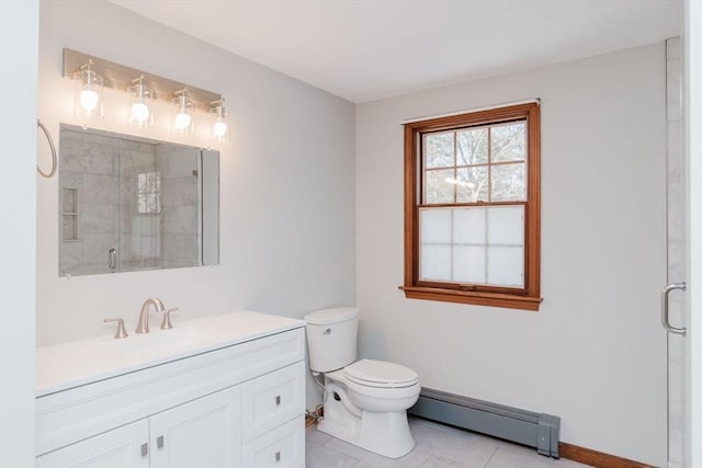 bathroom featuring tile patterned flooring, vanity, a baseboard heating unit, toilet, and a shower with door