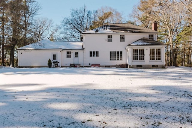 view of snow covered house