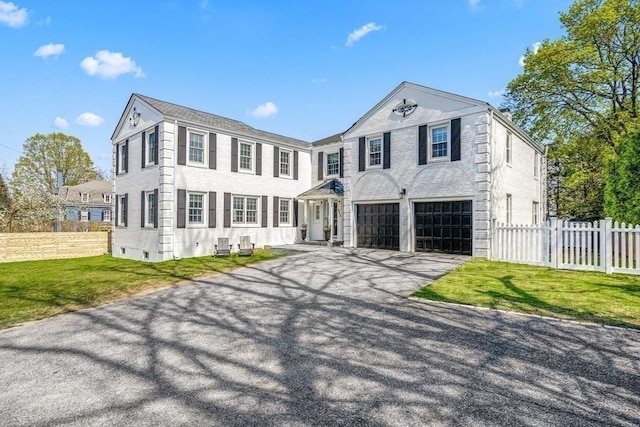 642 Centre St, Newton, MA 02458 - view of front of home featuring asphalt driveway and an attached garage