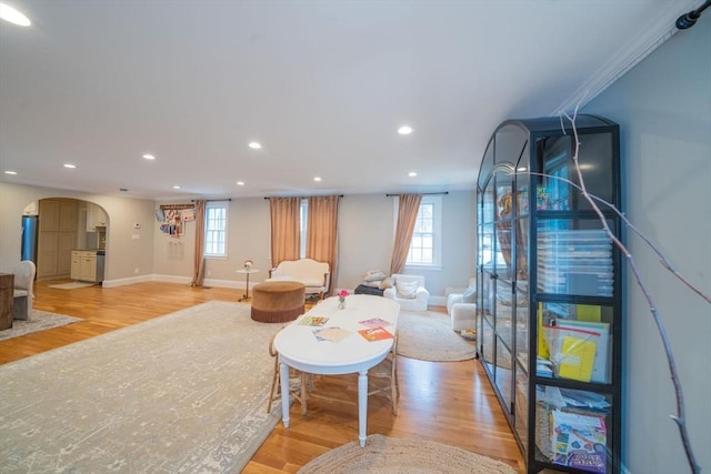 642 Centre St, Newton, MA 02458 - living area with arched walkways, light wood finished floors, recessed lighting, plenty of natural light, and baseboards