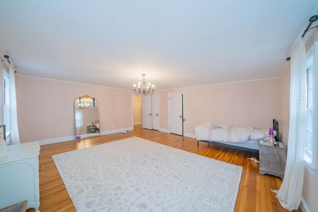 642 Centre St, Newton, MA 02458 - bedroom featuring a chandelier, baseboards, light wood-style flooring, and ornamental molding
