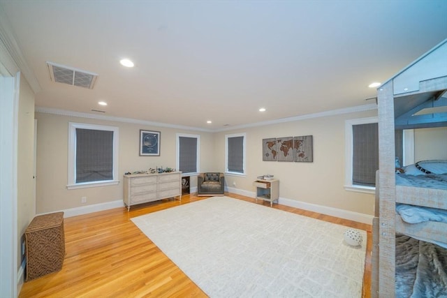 642 Centre St, Newton, MA 02458 - living area with light wood-style floors, ornamental molding, recessed lighting, and baseboards