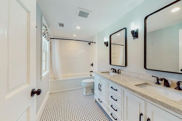 642 Centre St, Newton, MA 02458 - bathroom featuring toilet, shower / bath combo with shower curtain, double vanity, recessed lighting, and tile patterned floors