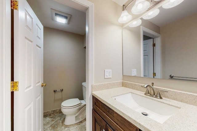 642 Centre St, Newton, MA 02458 - bathroom featuring toilet, vanity, and tile patterned flooring